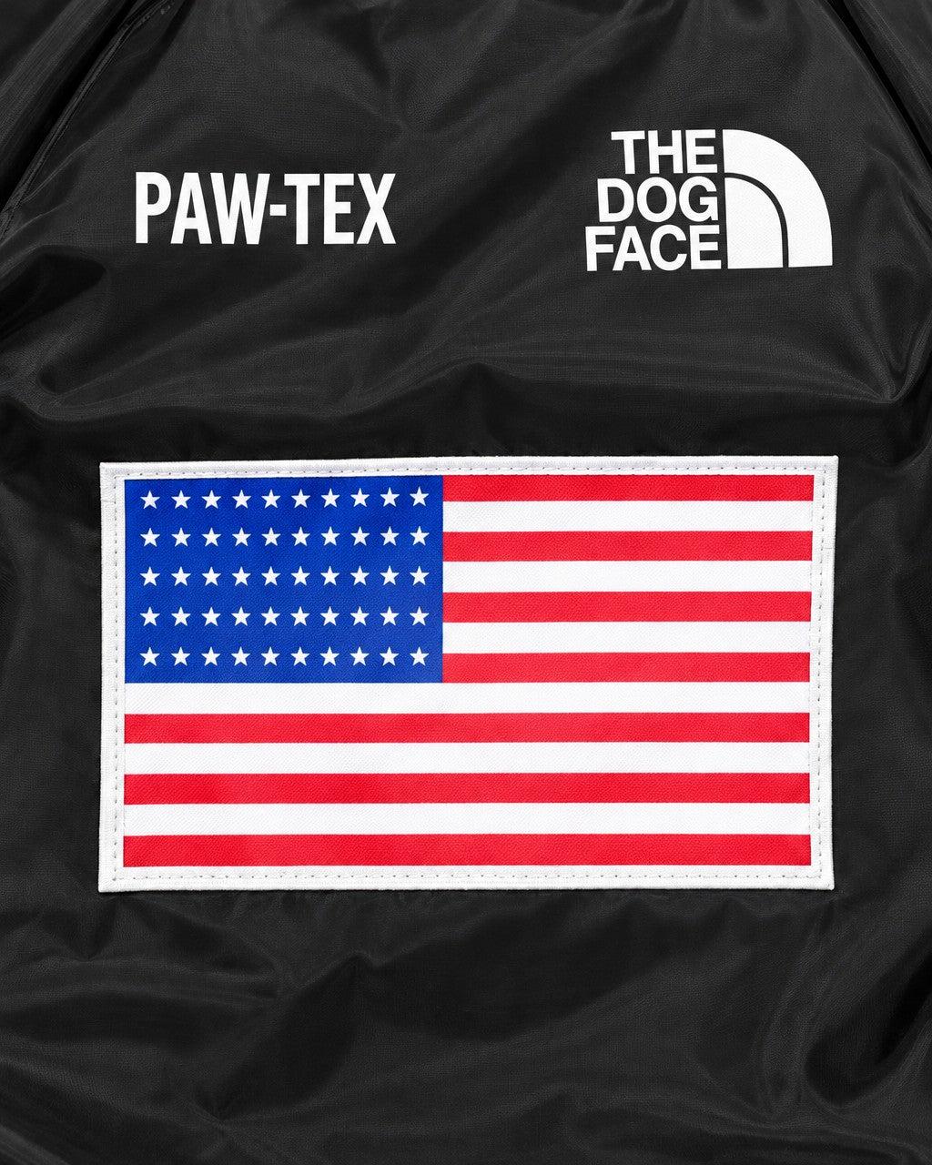 Dog Waterproof Jacket in black, flag patch and logo detail on the back