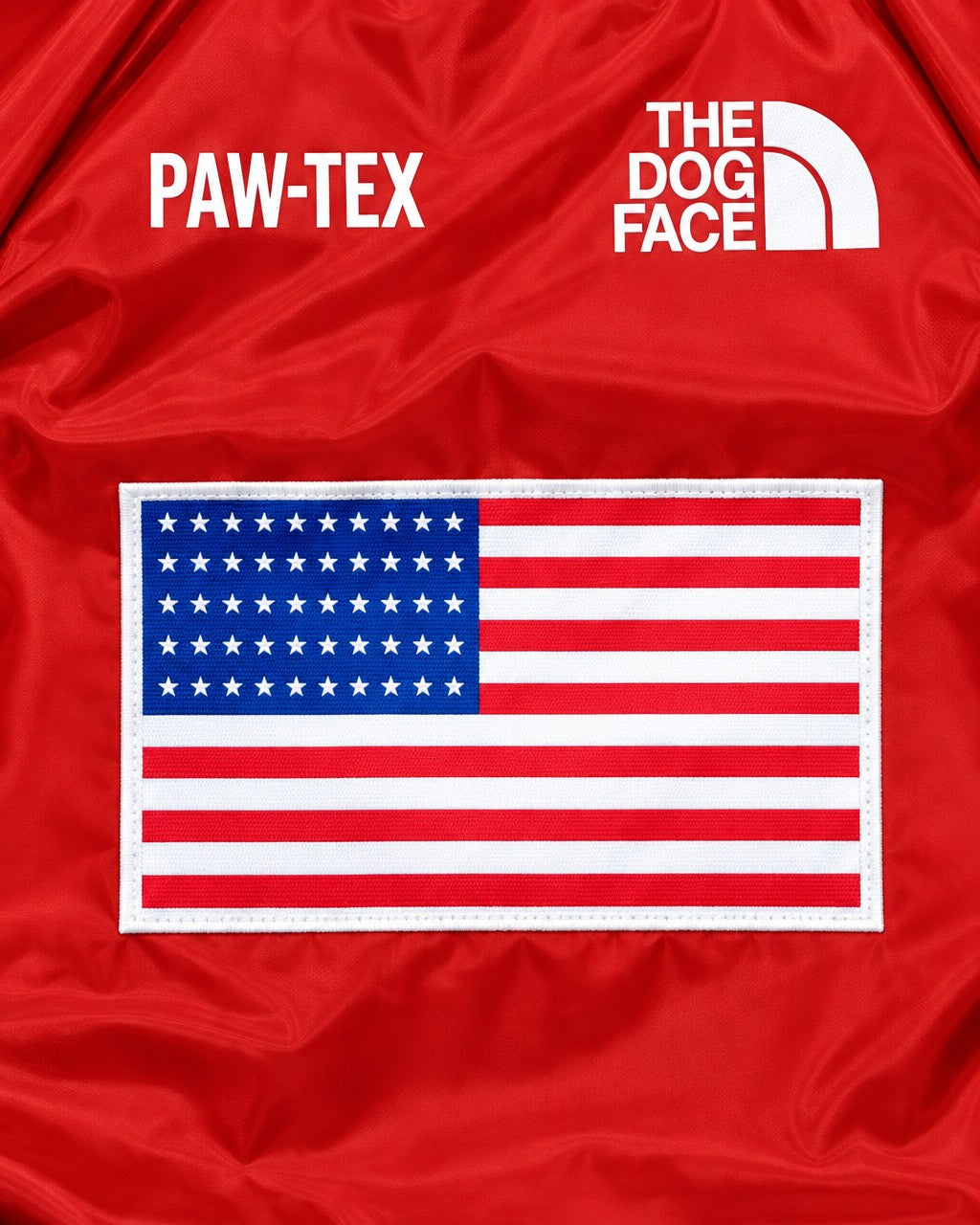 Dog Waterproof Jacket in red, flag patch and logo detail on the back